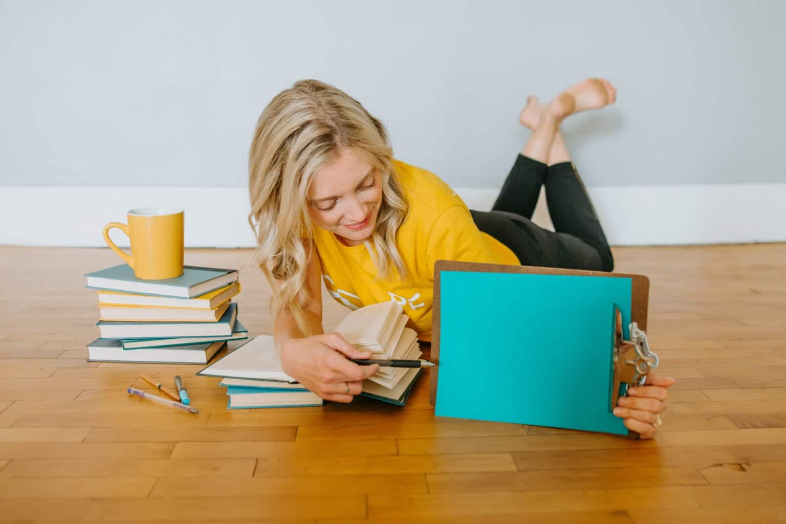 girl with branded yellow PF tshirt and books